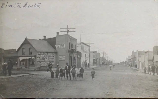 Main Street with children and storefronts